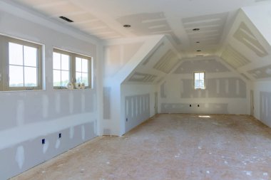 Plastering of drywall has been completed house is ready for painting clipart
