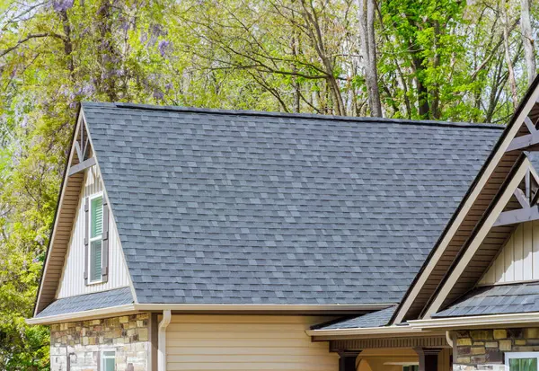 Asphalt shingles are used as roofing materials on roof of newly constructed house