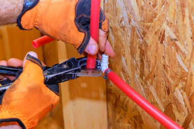 An installation connection to PVC plastic water pipes is completed by plumber