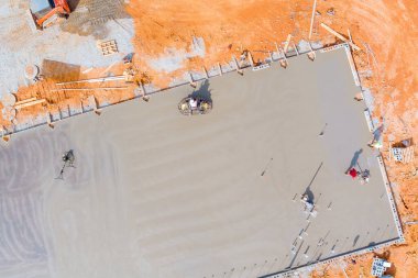 Foundation was poured with concrete workers polished concrete using concrete polishing machines.