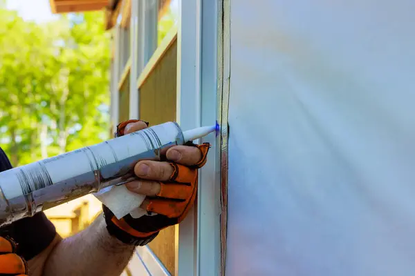 stock image When windows are installed, seams are treated with silicone coating, seals are stripped sealed