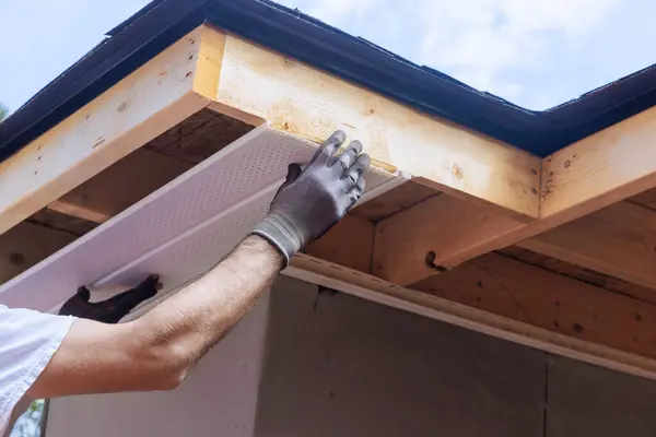 stock image An installation of upvc soffit board at corner of roof rafters ceiling