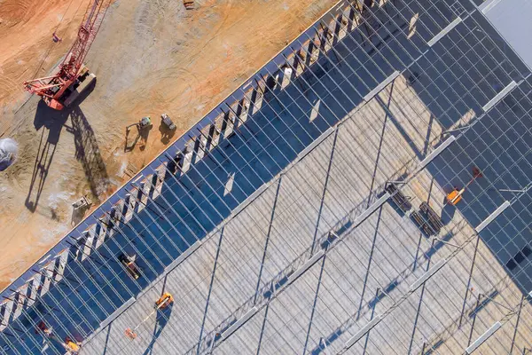 stock image Building of steel structure roof truss frame during construction metal warehouse