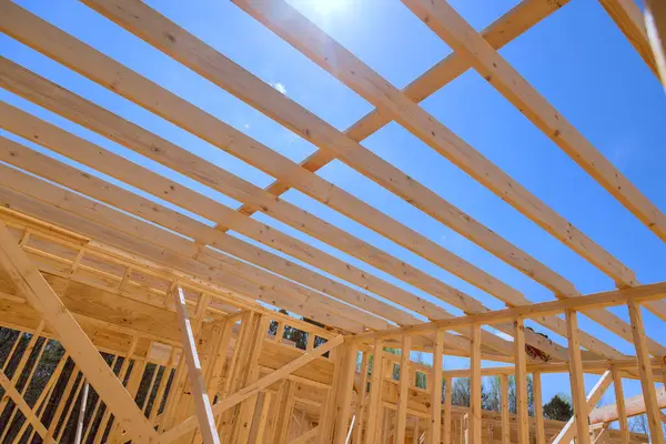 Stock image An installation ceiling roof trusses, framework beams, rafters was carried out during construction of new home