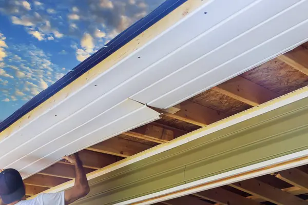 stock image Vinyl soffit plastic boards mounted to roof rafters