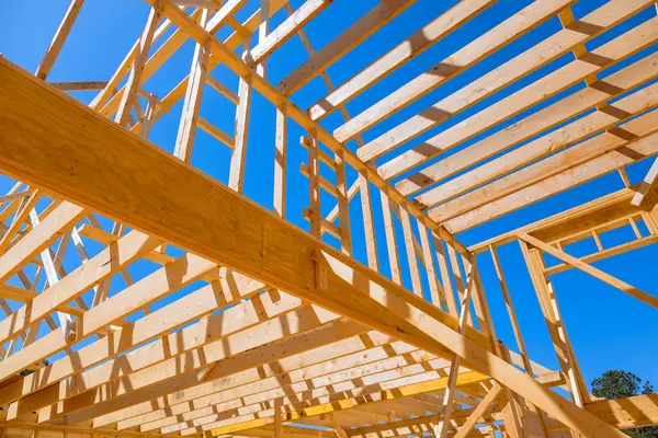 stock image As construction of new home, ceiling rafter framework beams were installed