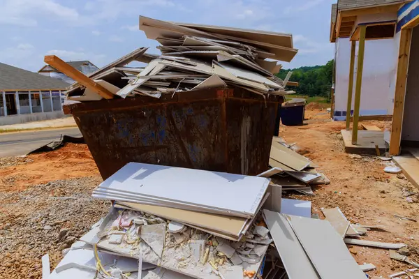 stock image Remains of plasterboard drywall were placed in construction waste container