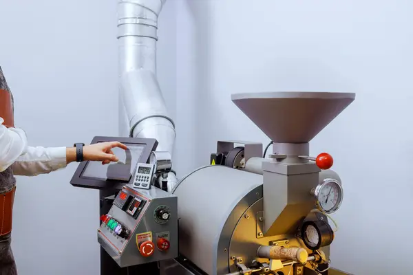 stock image Roasting of raw coffee beans takes place in machine