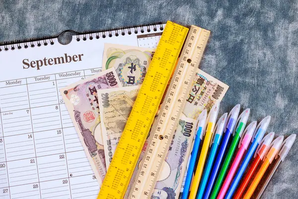 stock image In preparation for school, one needs to purchase school supplies is Japanese yen at store