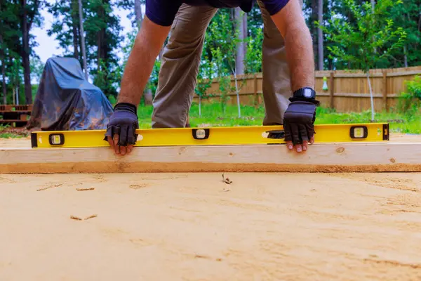 stock image When preparing platform for installation of swimming pool in backyard, leveling sand