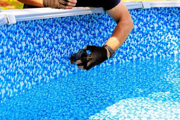 stock image Chlorination water filtration system installed in swimming pool frame by worker