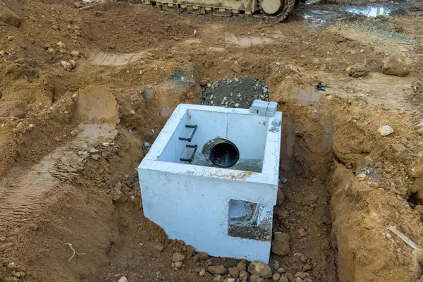 stock image Drainage concrete collectors well sewer system were installed underground for collection of rainwater at construction site.