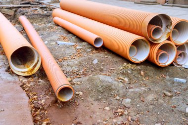 HDPE polyethylene sewer pipes awaiting installation clipart