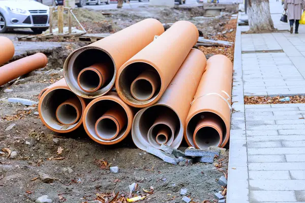 stock image Pipes of HDPE polyethylene sewer waiting to be installed, ready to form backbone of new infrastructure