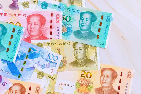 stock image In Chinese economy, paper money is used to represent yuan as cash banknote at various denominations