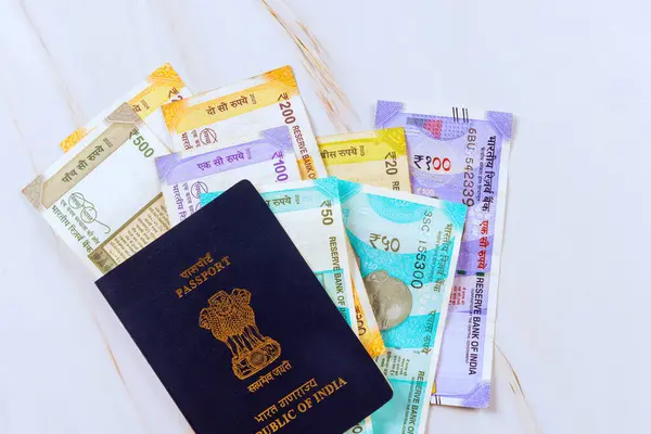 stock image Currency banknotes in various denominations of Indian rupees in passport for Republic of India