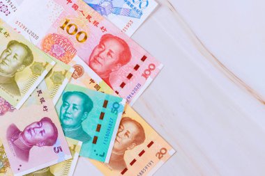 It is China economy that uses paper money in form of Chinese yuan cash banknotes in various denominations clipart