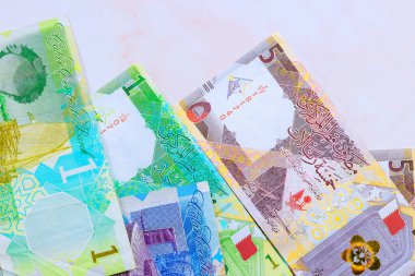 Bank of Qatar issued Qatari banknotes cash in various denominations in form of Qatari Riyals clipart