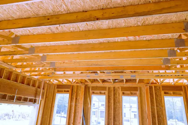 stock image Interior of newly constructed house with wooden stud timber framing beams