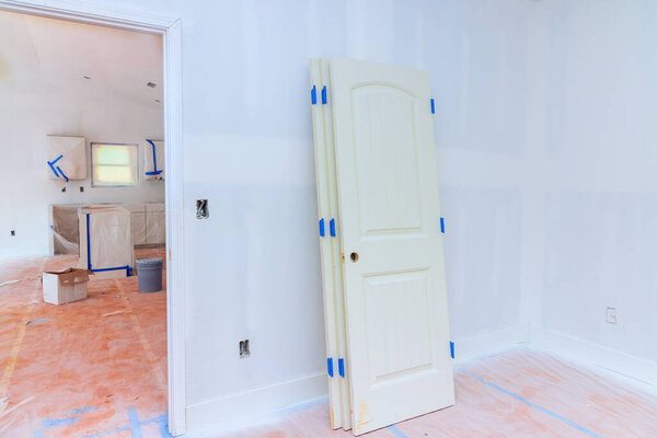 Paint is being applied to walls of newly renovated room in new apartment