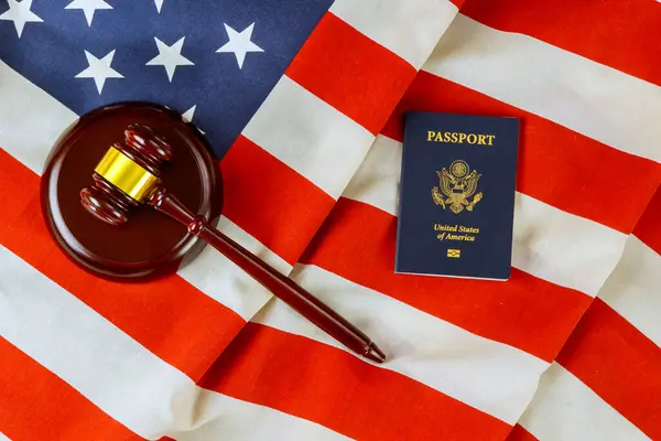 stock image There is symbol of justice law system in United States represented by American flag judge gavel, US passport