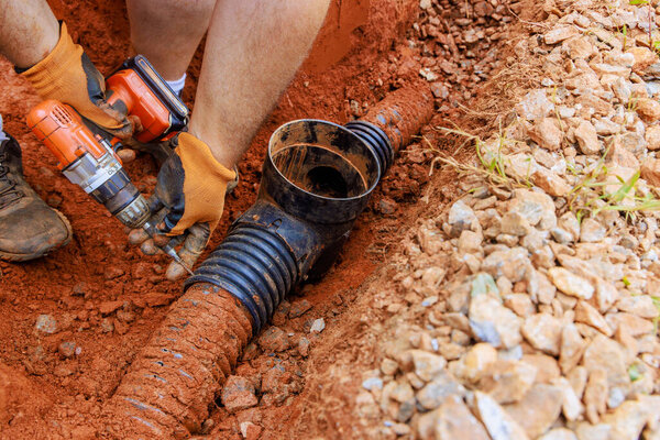 Drainage system damaged by rainwater is being replaced with underground storm sewers.
