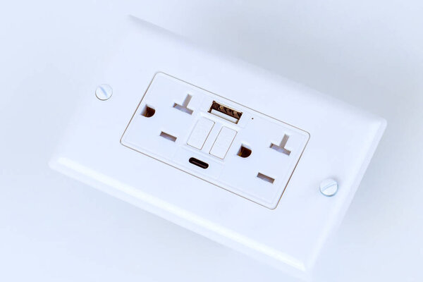 Electrical outlet features multiple sockets USB charging ports, providing convenient Self Test GFI access for powering devices in stylish minimalistic design