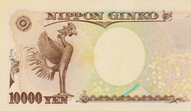 10000 yen banknote showing intricate details of phoenix, used in Japanese currency.