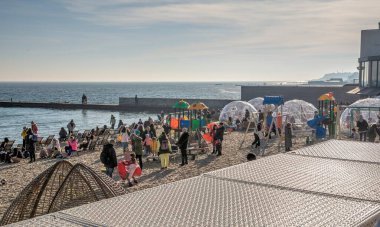 Odessa, Ukraine 02.01.2023. People relaxing in a beach restaurant on a sunny winter day