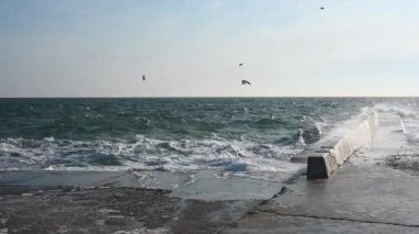 Odessa, Ukraine 08.02.2023. The coast of the stormy Black Sea on Lanzheron beach in Odessa, Ukraine, on a sunny winter day