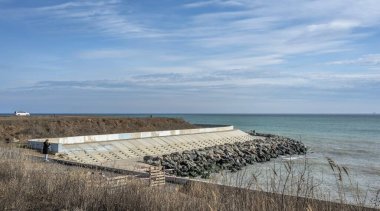 Odessa, Ukraine 18.02.2023. The coast of the Black Sea near Fontanka village in Odessa, Ukraine, on a sunny winter day