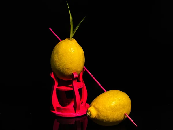 Creative still life with lemons on a black background
