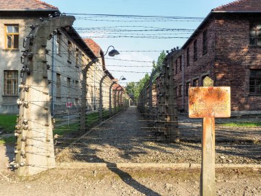 Auschwitz-Birkenau, Poland - July 31, 2017: Warning signs inside the prison camp