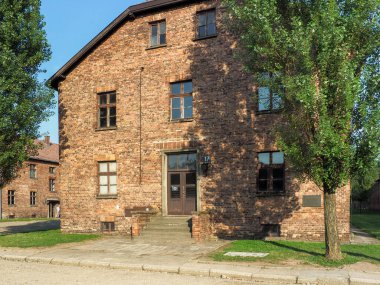 Auschwitz-Birkenau, Poland - July 31, 2017: Tenements and watchtowers inside the prison camp