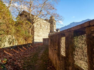 Sementina, Switzerland - december 9, 2016: Church of St. Bernard in the chestnut on Mornera. Ancient Romanesque church, in a tight angle but enriched with frescoes depicting the 