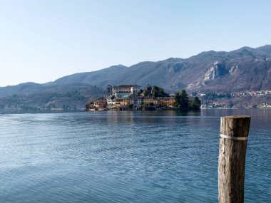 Orta San Giulio, Italy: a village located halfway along the eastern shore of Lake Orta clipart