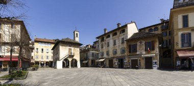 Orta San Giulio, Italy - March 13, 2017: a village located halfway along the eastern shore of Lake Orta clipart