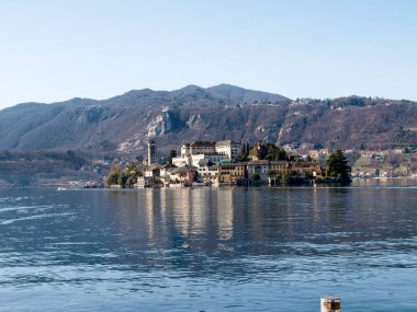 Orta San Giulio, Italy: a village located halfway along the eastern shore of Lake Orta clipart