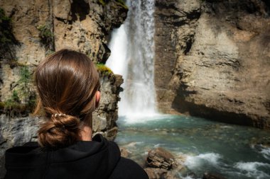 Person at Waterfall. Johnston Canyon