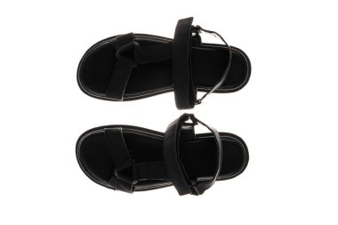 Beyaz arka planda izole edilmiş kadınlar ve kızlar için beyaz arka planda siyah sandaletler. Yüksek kalite fotoğraf