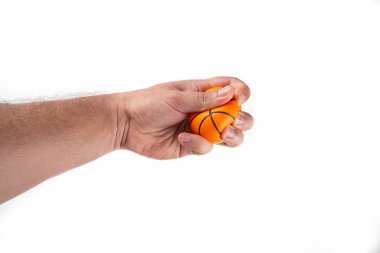 Basketball ball in hand isolated on white background. High quality photo clipart