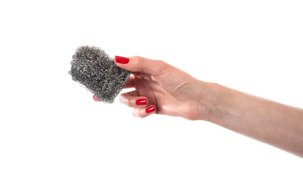 stock image Metal kitchen sponge in the hand isolated on a white background . High quality photo