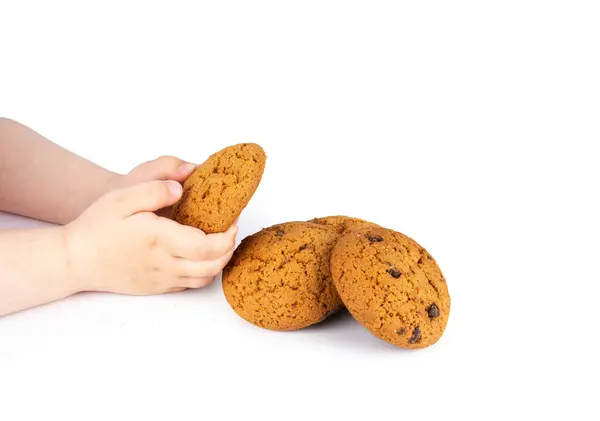 Stock image Child holds chip cookies on white background of closeup tasty bakery organic homemade American biscuit sweet dessert. High quality photo