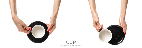 Female hands hold a white ceramic cup on white background. Female hands with fresh red manicure. Isolated on white background. High quality photo