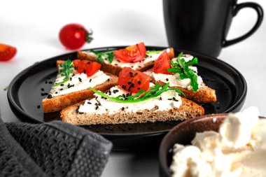 Bruschetta with cream cheese and vegetables isolated on a white background. Toasts and coffee isolated. Sandwich isolated. Sandwich with vegetables and cheese. High quality photo clipart