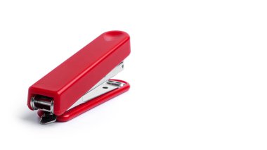 Red stapler on a white background. High quality photo clipart