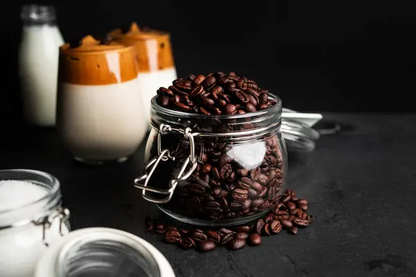 stock image Dalgona coffee on a dark background. Coffee composition. Coffee with foam. Coffee time. Coffee break. Coffee in a clear glass. High quality photo