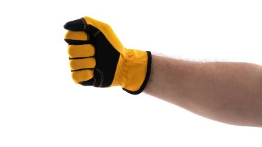 Sarı ve siyah eldivenli bir el, beyaz arka plana karşı bir yumruk oluşturur. Bu, gücü ve harekete hazır olmayı simgeler. Güçlendirme ve esneklik temaları için mükemmel..