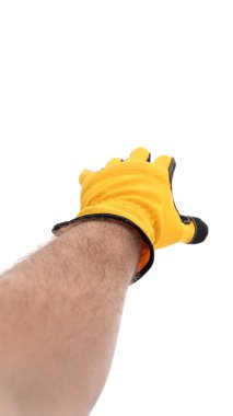 Parlak sarı bir eldiven giyen bir el dışarı doğru uzanıyor, bu da bir davet ya da hazırlık jesti olduğunu gösteriyor. Arka plan sade, eldiven ve el hareketini vurguluyor..