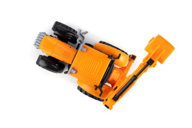 Traktör. Kazıcı. Sınıf. Çocuk oyuncağı. Beyaz arka planda çocuk oyuncağı. Yüksek kalite fotoğraf